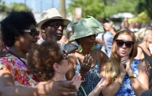 People pray and listen to the Sunday service outside of the Emanuel AME Church in Charleston, South Carolina on June 21, 2015. Large crowds arrived at Sunday's service at the black church in Charleston where nine African Americans were gunned down, as a chilling website apparently created by the suspected white supremacist shooter emerged. The service will be the first since the bloodbath on Wednesday at the Emanuel African Methodist Episcopal Church in the southern state of South Carolina, which has fuelled simmering racial tensions in the United States and reignited impassioned calls for stronger gun-control laws. AFP PHOTO/ MLADEN ANTONOV (Photo credit should read MLADEN ANTONOV/AFP/Getty Images)